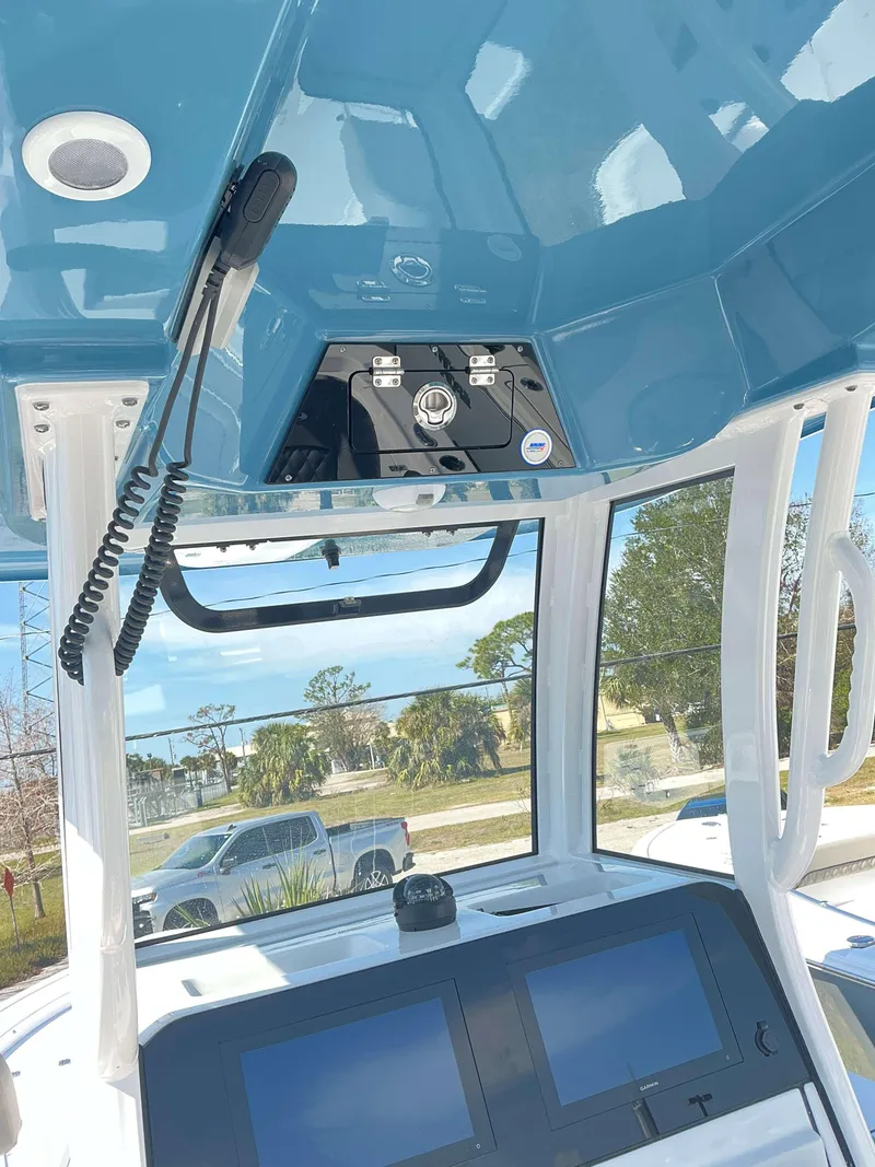 Slide: The Image of Interior view of 2025 Sportsman 247 MASTERS boat with modern dashboard and controls. - 17