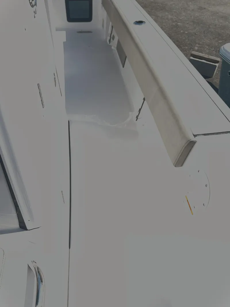 Slide: The Image of 2025 Sportsman 247 MASTERS boat interior, featuring sleek white deck and seating area. - 18