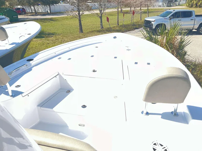 Slide: The Image of 2025 Sportsman 247 MASTERS boat deck with seating, parked truck in background. - 5