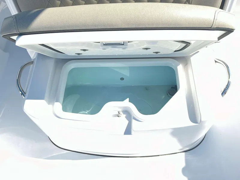 Slide: The Image of Livewell compartment in 2025 Sportsman 247 MASTERS boat, featuring cushioned seating. - 6