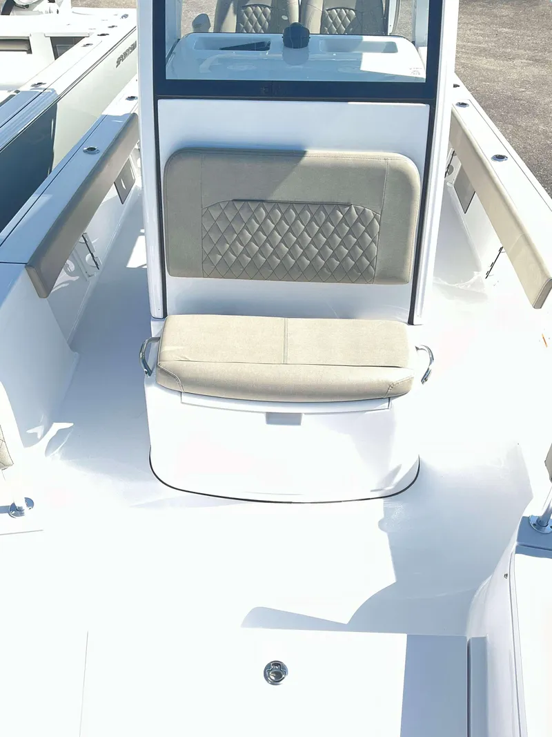 Slide: The Image of 2025 Sportsman 247 MASTERS boat interior with cushioned seating and sleek design. - 7