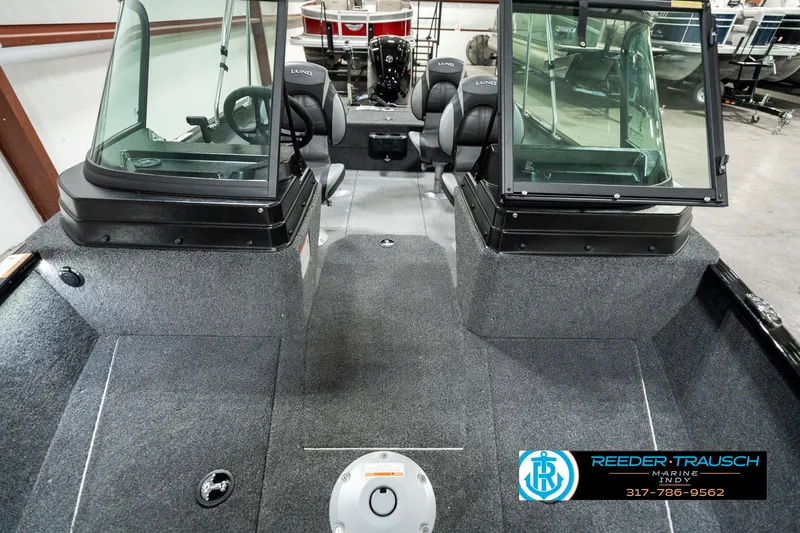 Slide: The Image of 2025 Lund 1775 Adventure Sport boat interior with dual consoles and seating. - 12