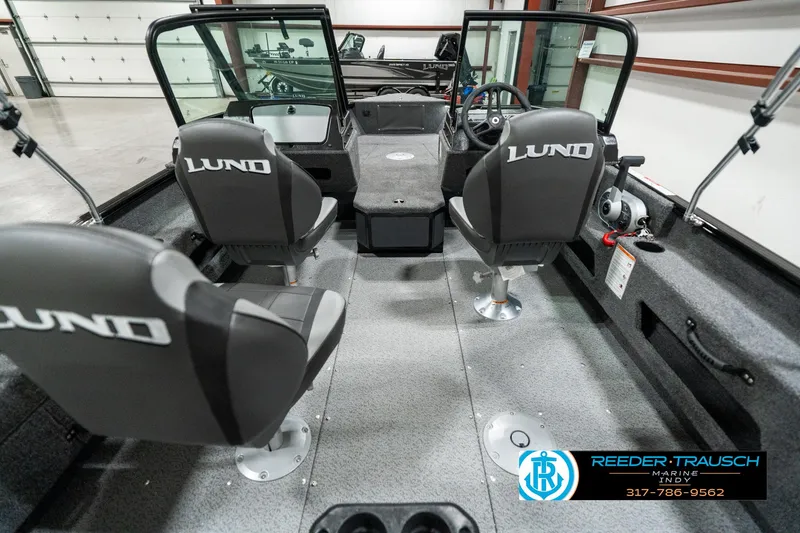 Slide: The Image of 2025 Lund 1775 Adventure Sport boat interior with seating and steering console. - 15