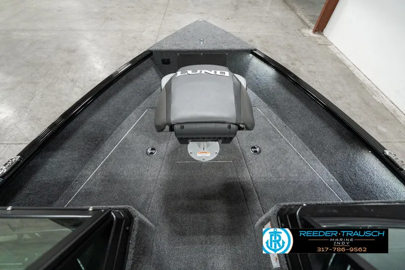 Slide: The Image of 2025 Lund 1775 Adventure Sport boat interior with seating and carpeted deck. - 19