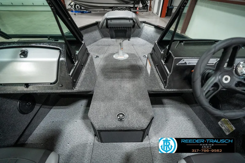 Slide: The Image of 2025 Lund 1775 Adventure Sport boat interior with seating and steering wheel. - 20