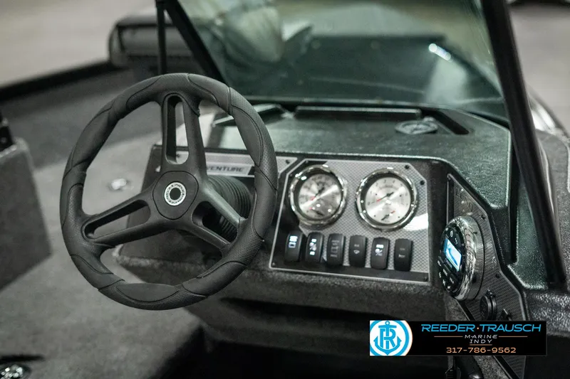 Slide: The Image of 2025 Lund 1775 Adventure Sport dashboard with steering wheel and gauges. - 27