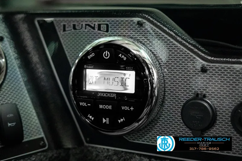 Slide: The Image of 2025 Lund 1775 Adventure Sport dashboard with Kicker audio system. - 29