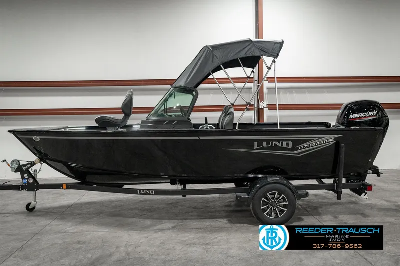 Slide: The Image of 2025 Lund 1775 Adventure Sport boat with canopy in showroom. - 4