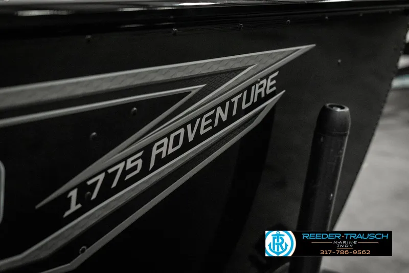 Slide: The Image of 2025 Lund 1775 Adventure Sport boat, sleek design with logo detail. - 46