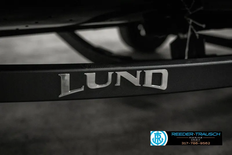 Slide: The Image of 2025 Lund 1775 Adventure Sport boat logo on trailer, Reeder-Trausch branding visible. - 47
