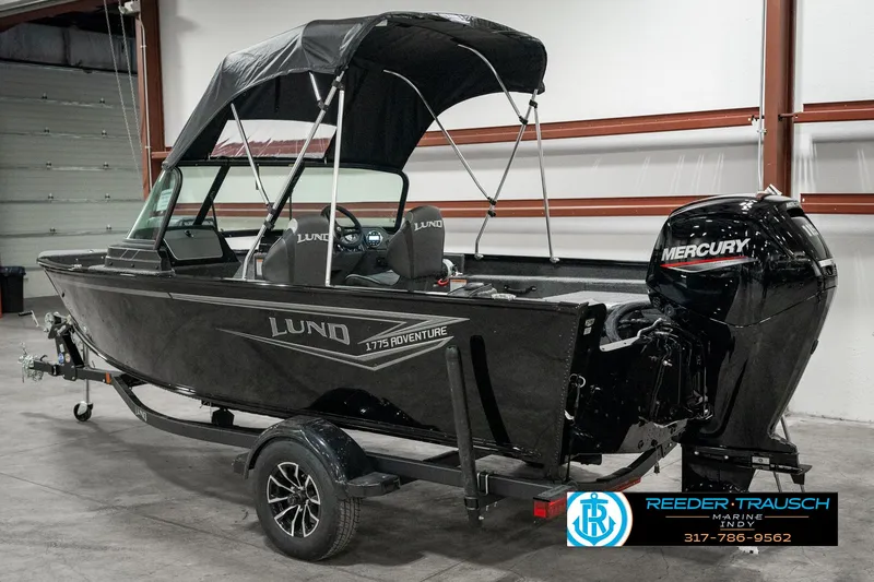 Slide: The Image of 2025 Lund 1775 Adventure Sport boat with Mercury engine in showroom. - 5
