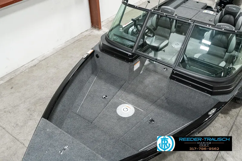 Slide: The Image of 2025 Lund 1775 Adventure Sport boat interior with seating and steering console. - 8