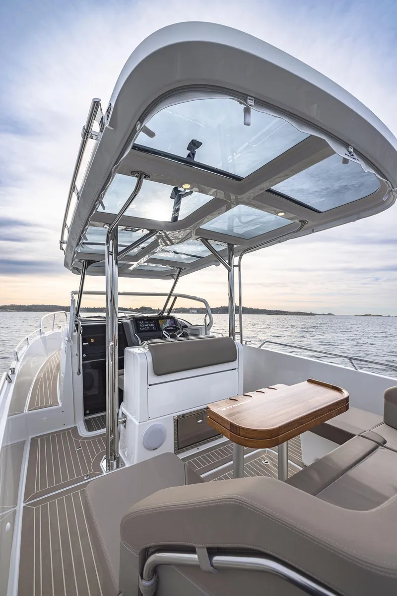 Slide: The Image of 2025 Nimbus Tender 9 boat interior with sleek design and modern amenities on open water. - 7