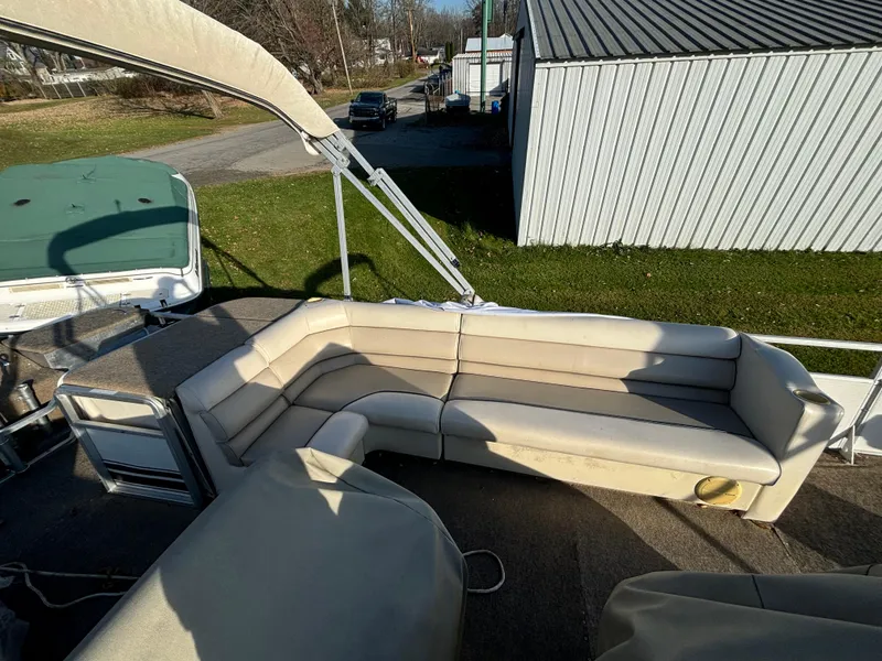 Slide: The Image of 1996 Harris-Kayot Classic 240 O/B boat with beige seating and canopy. - 7