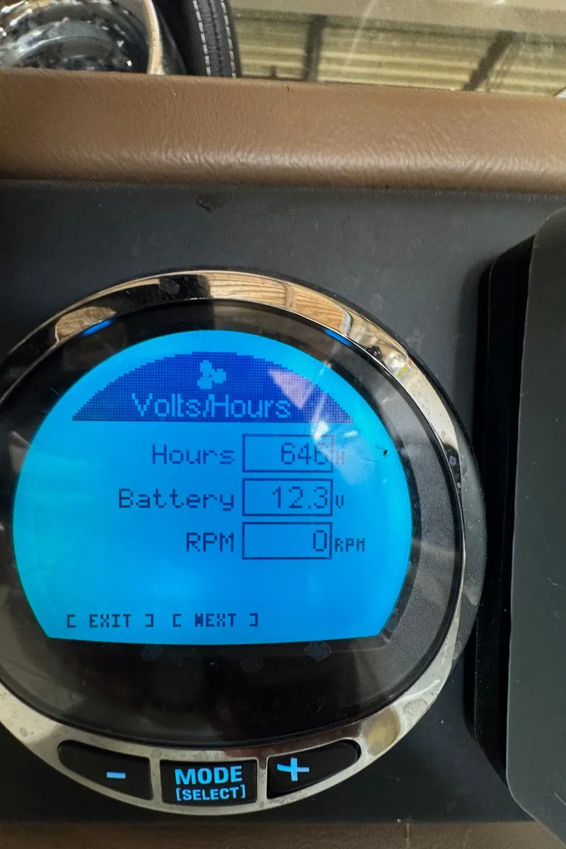 Slide: The Image of Digital display on 2023 Crownline 215 XS showing battery voltage and engine hours. - 9