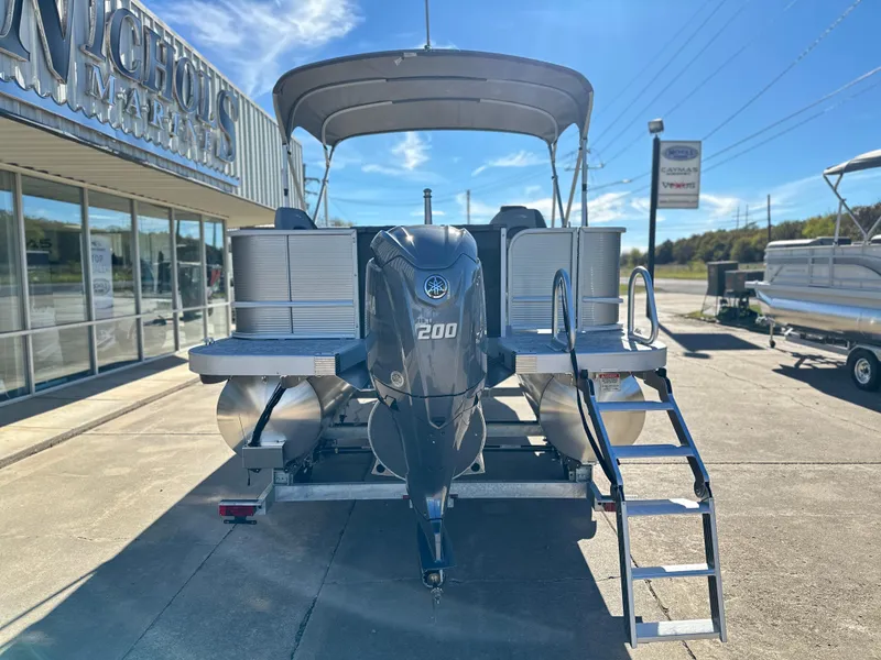 Slide: The Image of 2025 Bennington 23 SS pontoon boat with 200 HP engine at marina. - 3