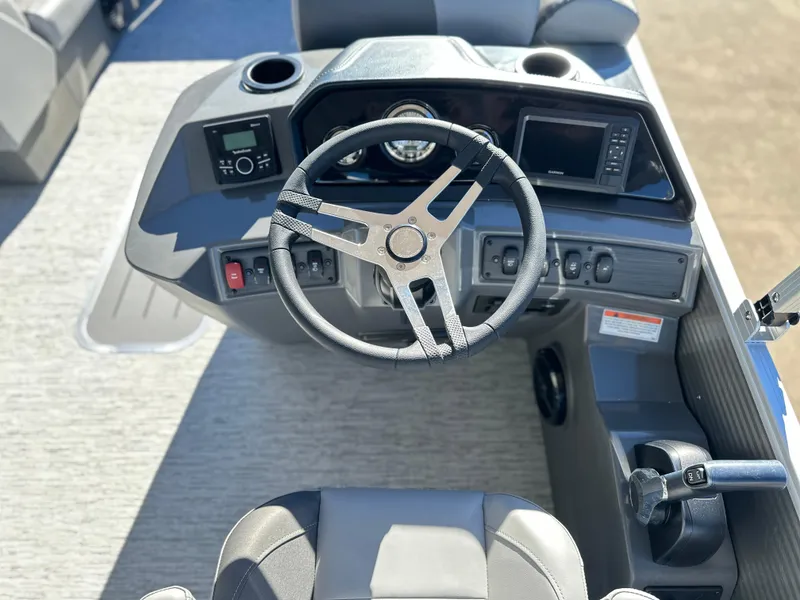 Slide: The Image of 2025 Bennington 23 SS boat dashboard with steering wheel and control panel. - 5