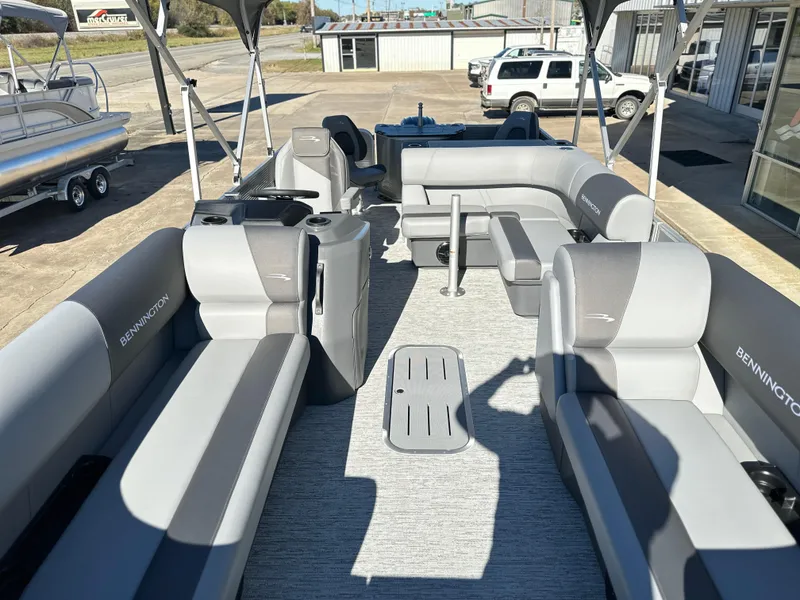 Slide: The Image of 2025 Bennington 23 SS pontoon boat with spacious seating and modern design. - 7
