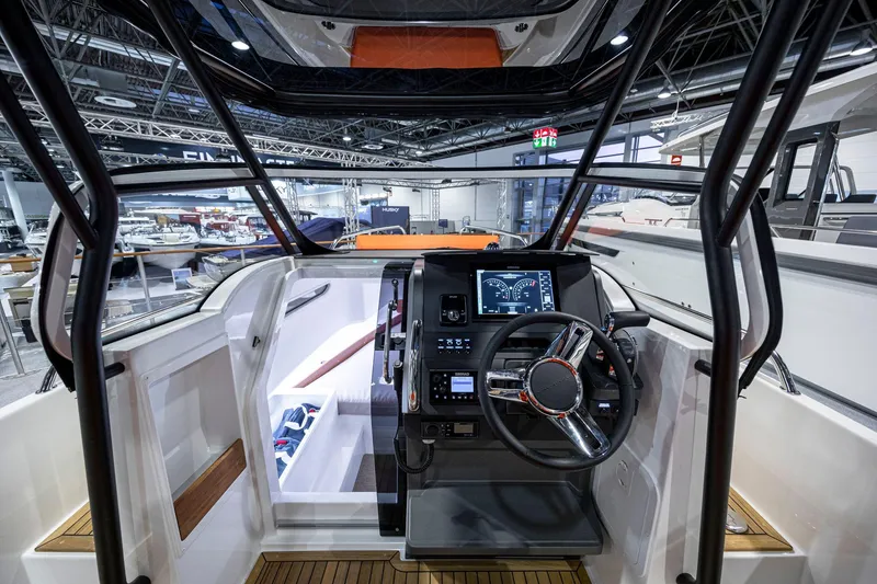 Slide: The Image of Interior view of 2025 Nimbus Tender 8 boat cockpit with modern controls. - 5