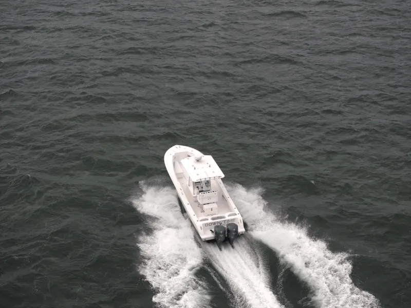 Slide: The Image of Invincible 33 Open Fisherman boat cruising on open water, 2012 model. - 11