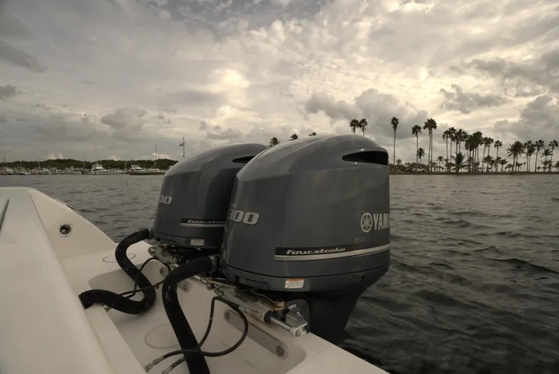 Slide: The Image of 2012 Invincible 33 Open Fisherman with Yamaha engines on a cloudy day. - 18