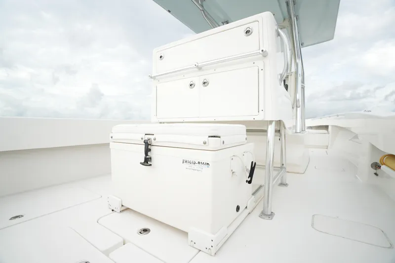 Slide: The Image of 2012 Invincible 33 Open Fisherman boat deck with storage compartments. - 24