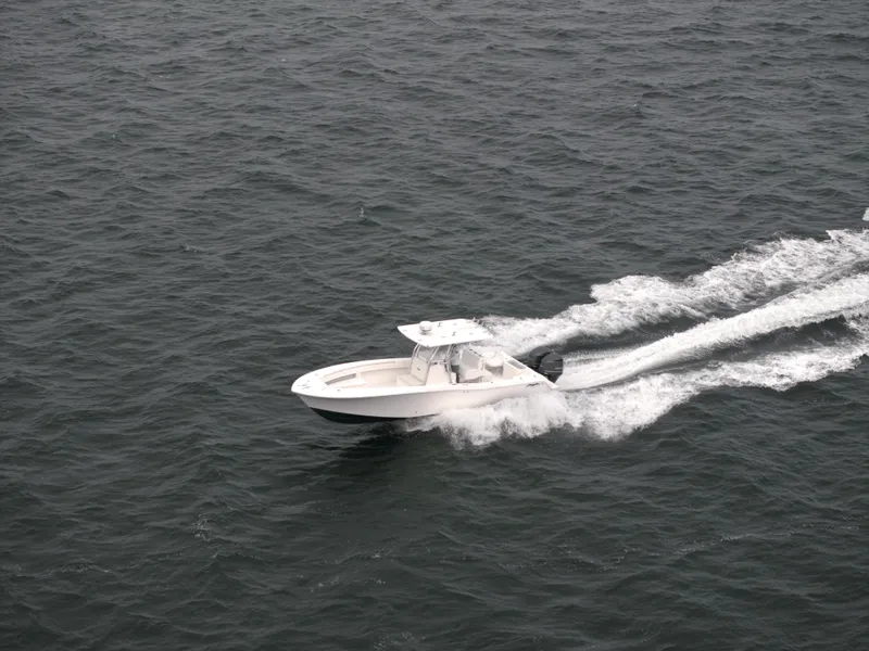 Slide: The Image of 2012 Invincible 33 Open Fisherman boat speeding on open water. - 6
