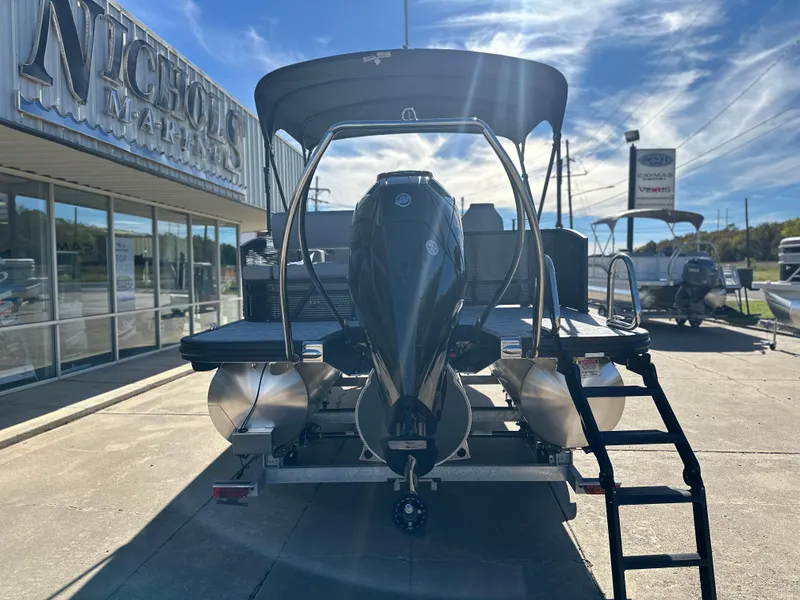 Slide: The Image of 2025 Bennington 23 SSB pontoon boat displayed at dealership, rear view. - 3