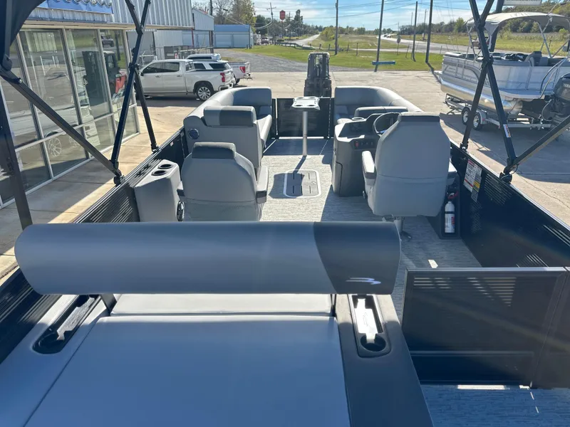 Slide: The Image of 2025 Bennington 23 SSB pontoon boat interior with seating and steering console. - 4