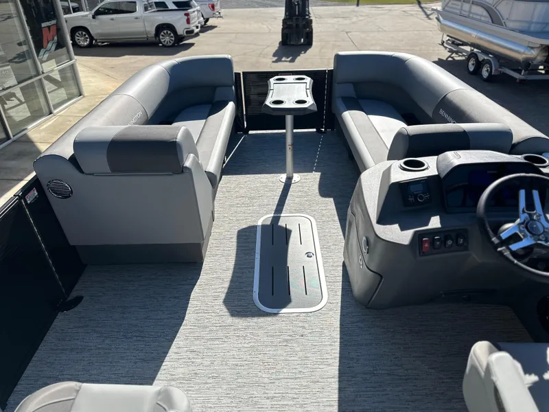 Slide: The Image of 2025 Bennington 23 SSB pontoon boat interior with gray seating and steering console. - 6