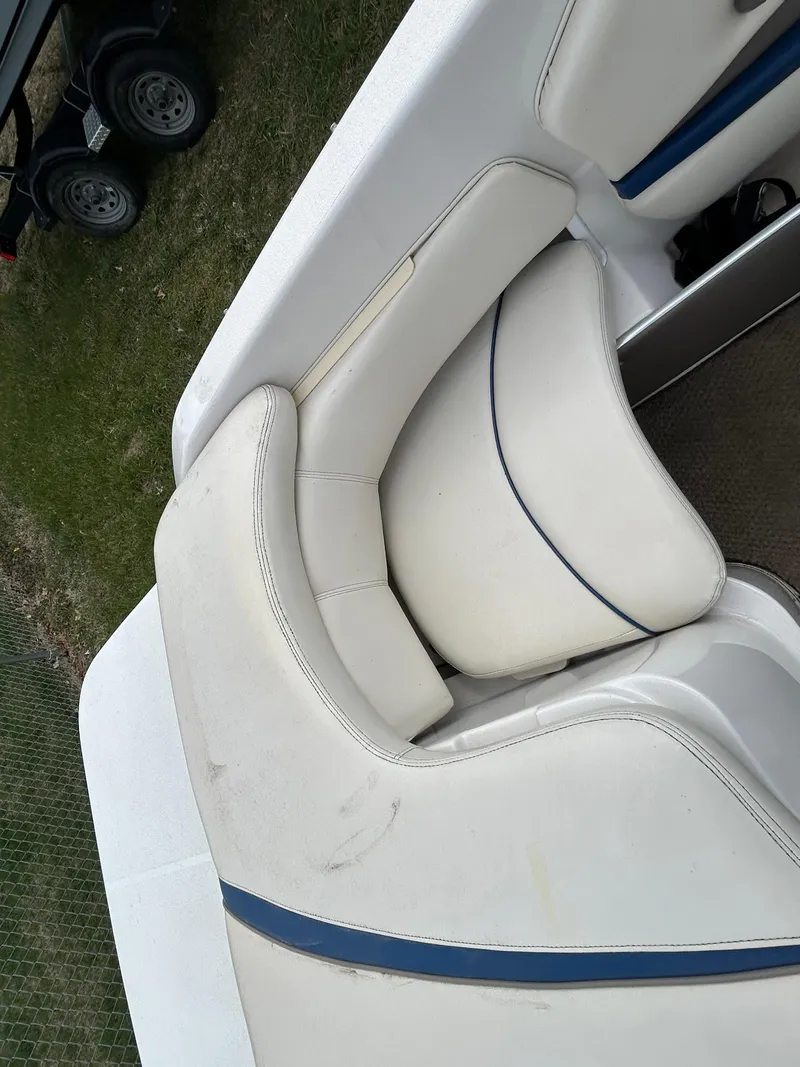 Slide: The Image of 2001 Four Winns 180 Horizon boat interior seating with white and blue upholstery. - 3