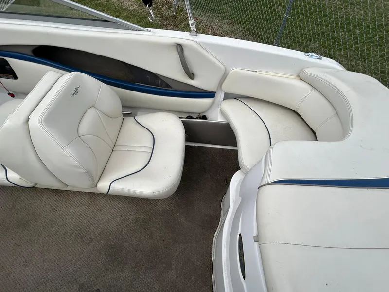 Slide: The Image of 2001 Four Winns 180 Horizon boat interior with white and blue seating. - 4