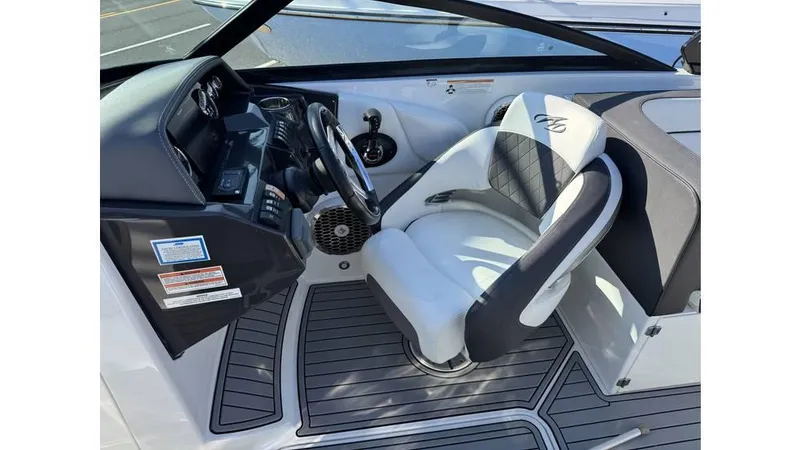 Slide: The Image of 2020 Monterey M65 boat cockpit with steering wheel and captain's chair. - 3