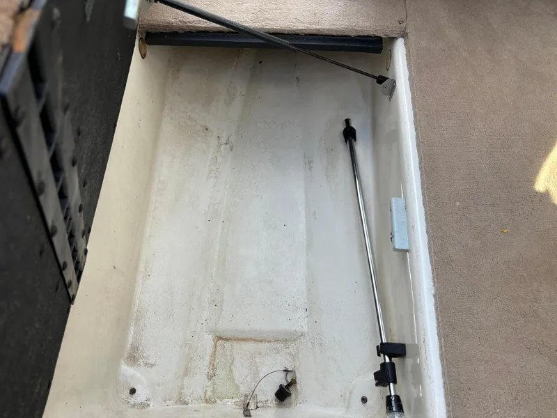 Slide: The Image of Empty storage compartment in 1999 Sea Ray 190 Bow Rider boat. - 6