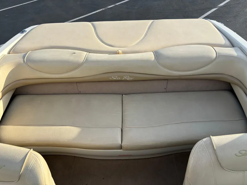 Slide: The Image of 1999 Sea Ray 190 Bow Rider boat seating, beige upholstery, rear view. - 7