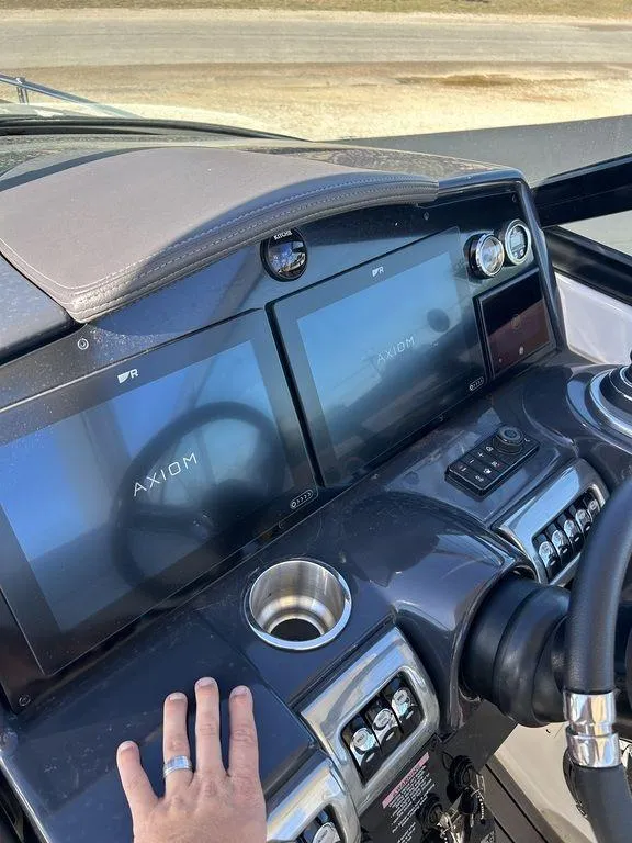 Slide: The Image of 2023 Formula 350 Crossover Bowrider dashboard with dual Axiom displays and controls. - 15