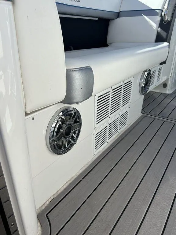 Slide: The Image of 2023 Formula 350 Crossover Bowrider interior with speakers and seating detail. - 27
