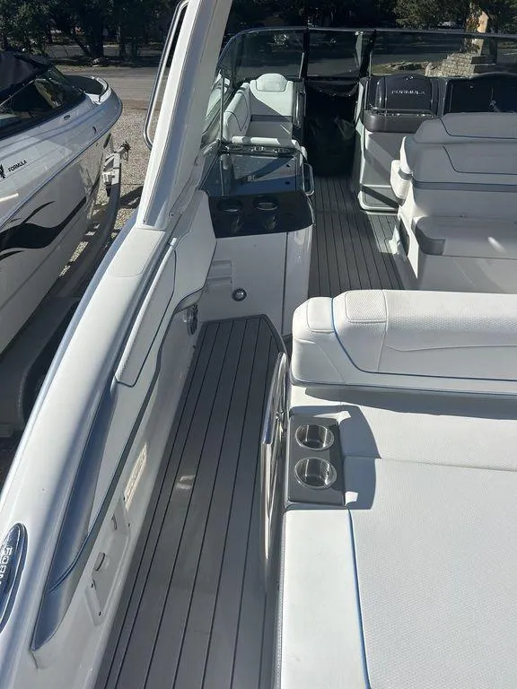 Slide: The Image of 2023 Formula 350 Crossover Bowrider with spacious seating and sleek design. - 5