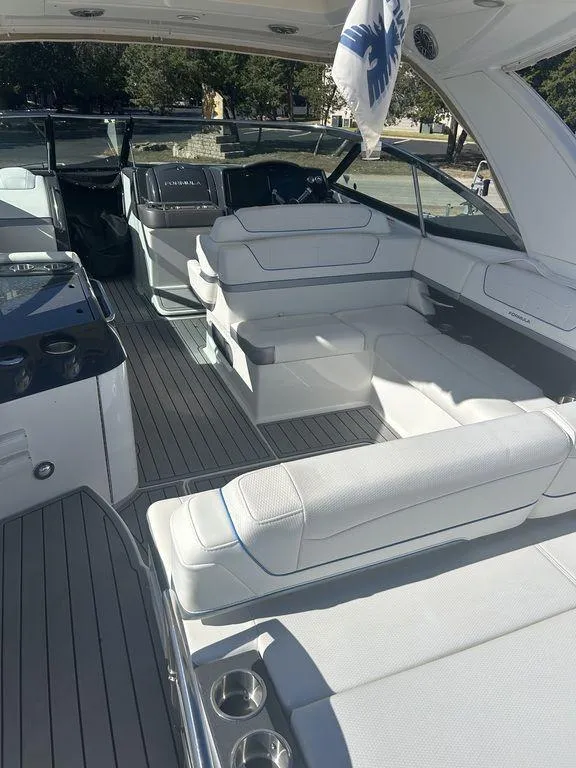 Slide: The Image of 2023 Formula 350 Crossover Bowrider interior with luxurious seating and modern design. - 6