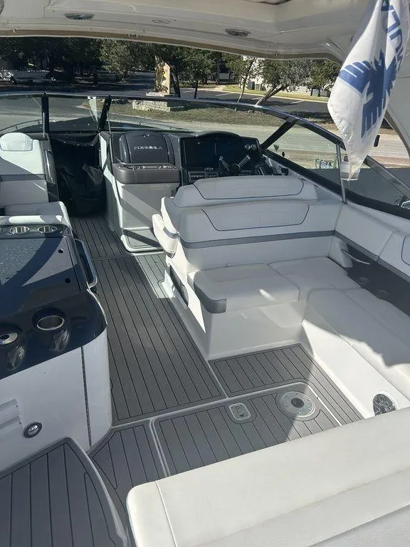 Slide: The Image of 2023 Formula 350 Crossover Bowrider interior with luxurious seating and modern design. - 7