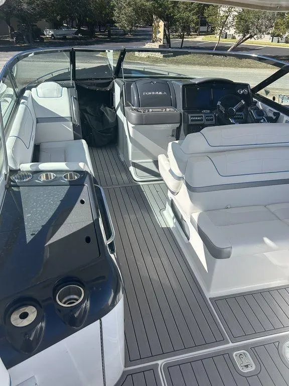 Slide: The Image of 2023 Formula 350 Crossover Bowrider interior with sleek seating and modern dashboard. - 8