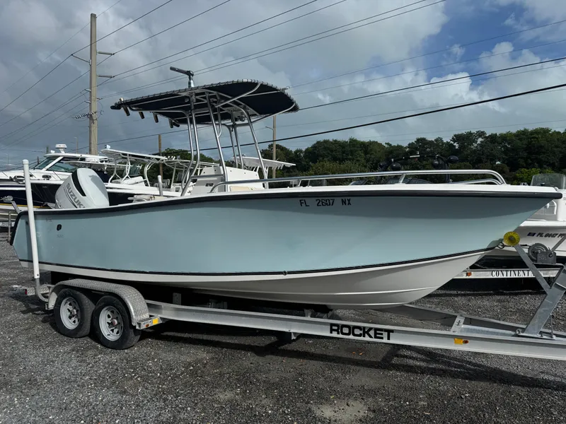 The Image of 2008 Mako 212 Center Console boat on trailer, parked outdoors. - 1
