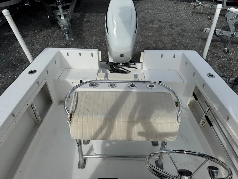 Slide: The Image of 2008 Mako 212 Center Console boat interior with steering wheel and seating. - 14