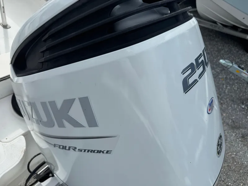 Slide: The Image of Suzuki 250 four-stroke outboard motor on 2008 Mako 212 Center Console boat. - 16