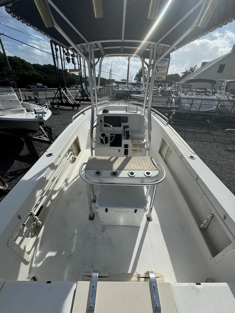 Slide: The Image of 2008 Mako 212 Center Console boat with T-top and spacious deck. - 4