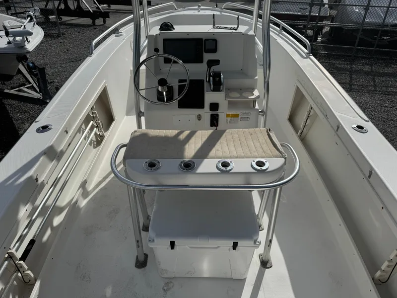 Slide: The Image of 2008 Mako 212 Center Console boat interior with steering wheel and seating. - 5