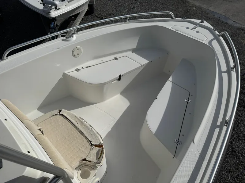 Slide: The Image of 2008 Mako 212 Center Console boat interior with seating and storage compartments. - 9