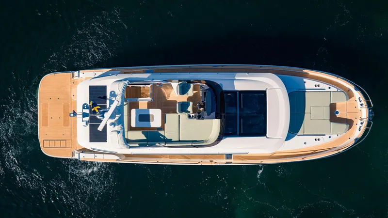 Slide: The Image of Aerial view of 2025 Nimbus 495 Flybridge luxury yacht on open water. - 3