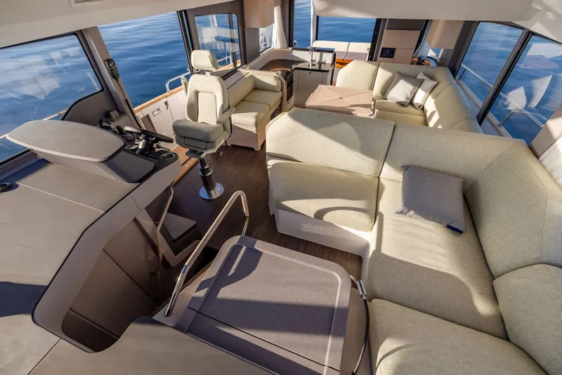 Slide: The Image of Luxurious interior of 2025 Nimbus 495 Flybridge yacht with spacious seating and helm. - 32