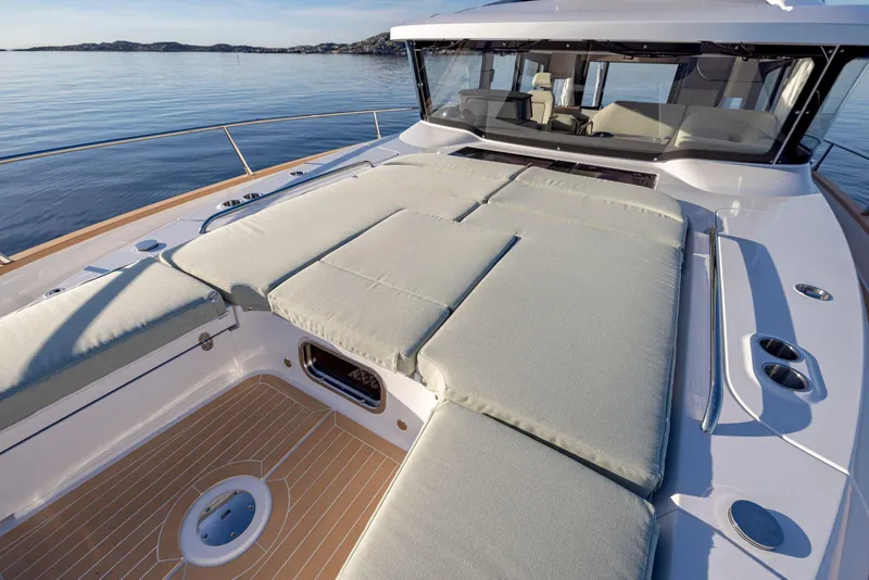Slide: The Image of 2025 Nimbus 495 Flybridge yacht with spacious sun deck and luxurious seating. - 38